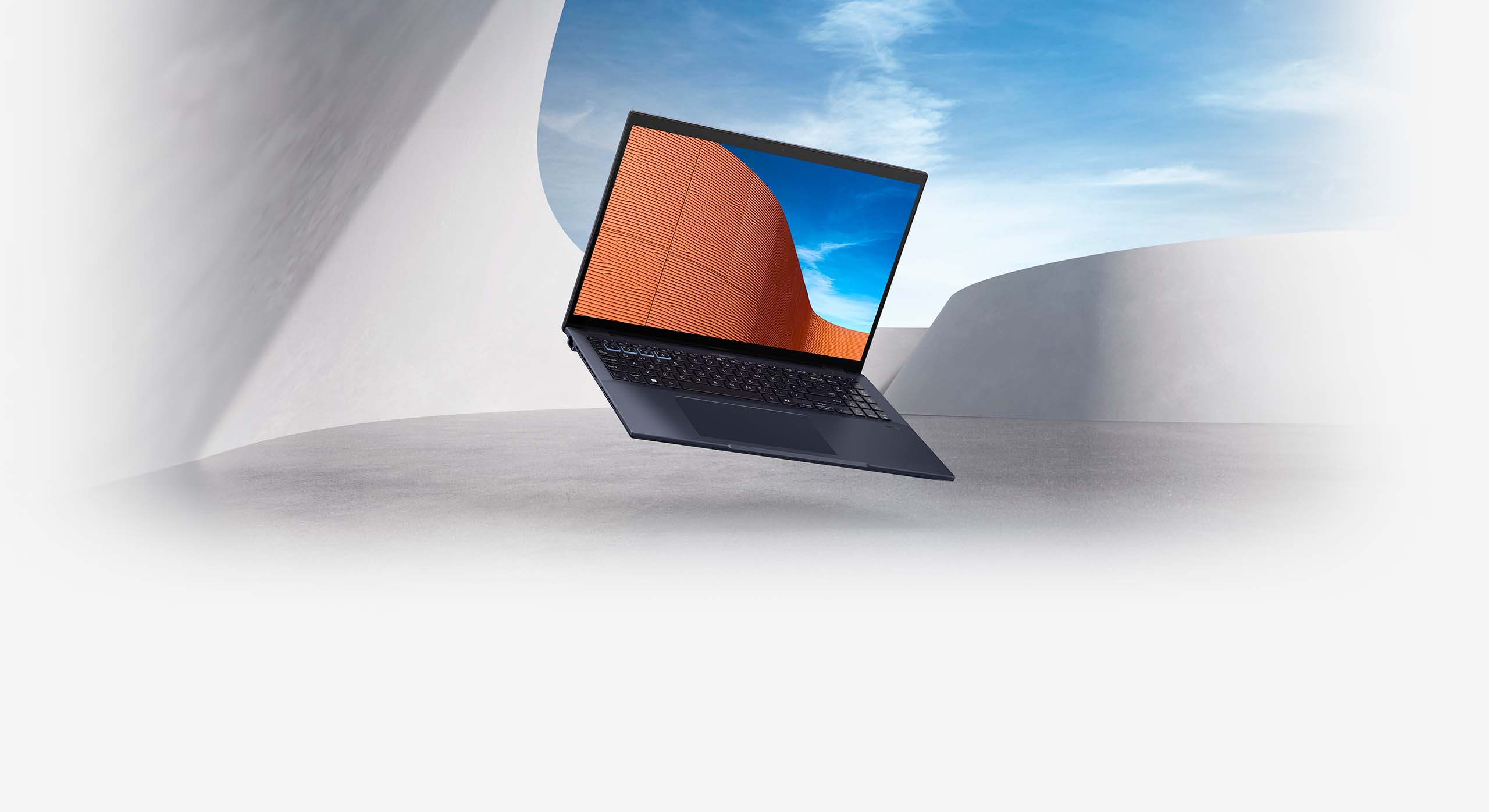 Side view of ASUS ExpertBook B3 on the platform, with blue sky and minimalist architecture background.